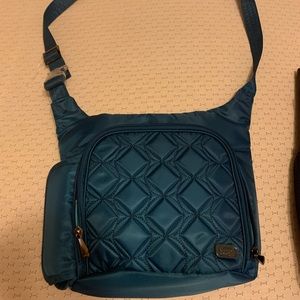 Lug Sidecar crossbody bag teal color. New - never used